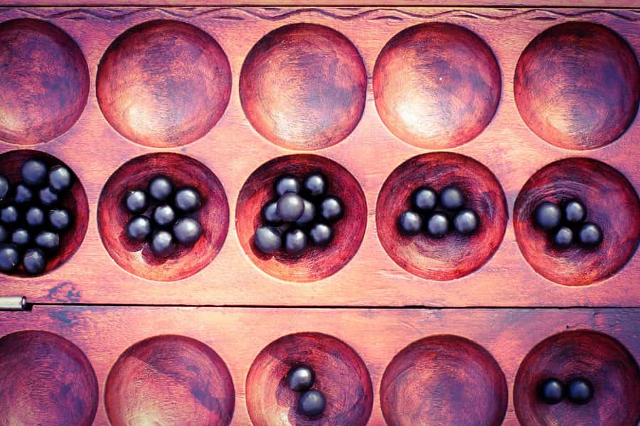 Kigali: Learn Rwandan Table Game (IGISORO) with a Local - The social meaning behind the board